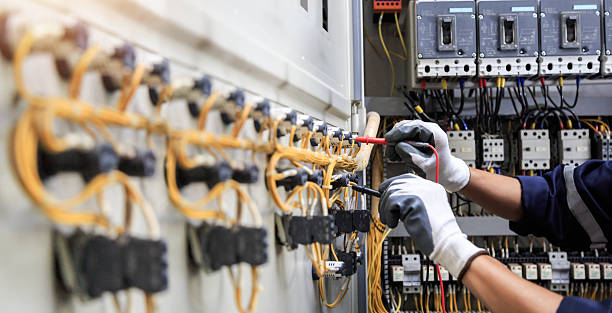 Professional Electrician technician working in Walton County County, FL